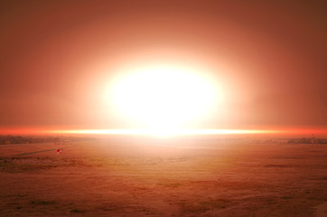 Explosion of nuclear bomb over land 