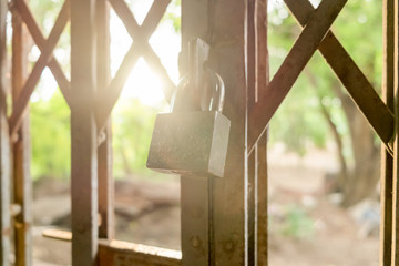 Lock padlock on the steel rust door