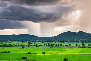 Obraz na płótnie Canvas Mountain green field scenic beautiful raining storm phenomenon nature on wat tham sua viewpoint, kanchanaburi