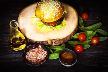 Obraz na płótnie Canvas homemade veggie burger in a bun with sesame