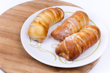 Homemade sweet baked rolls buns copy space over white