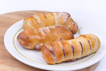 Homemade sweet baked rolls buns copy space over white