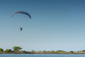 Paramotor on the sky in the evening:Close up,select focus with s