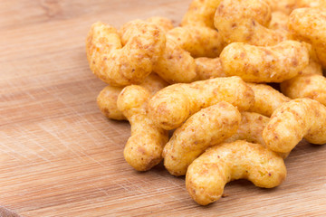 Snacks with peanuts on a wooden board