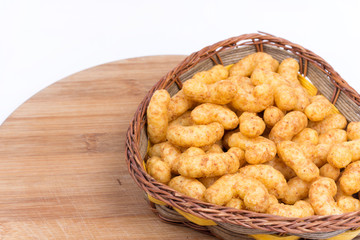 Macro closeup snacks with peanuts on a wooden board