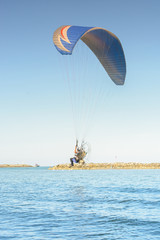 Paramotor on the sky in the evening:Close up,select focus with s