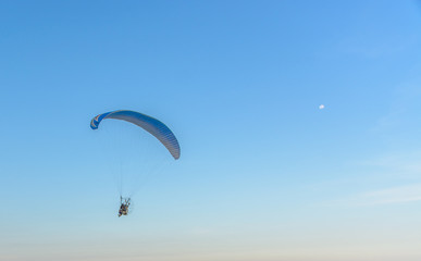 Paramotor on the sky in the evening:Close up,select focus with s