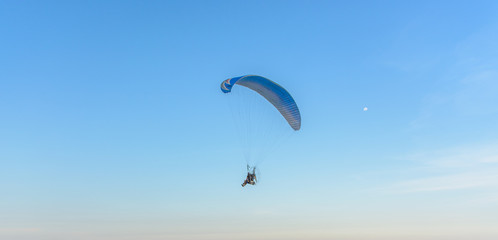 Paramotor on the sky in the evening:Close up,select focus with s
