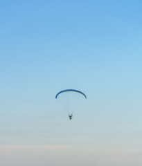 Paramotor on the sky in the evening:Close up,select focus with s