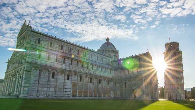 famous pisa landmark leaning tower miracoli square time lapse 4k,sunrise at dawn behind the dome sunrays