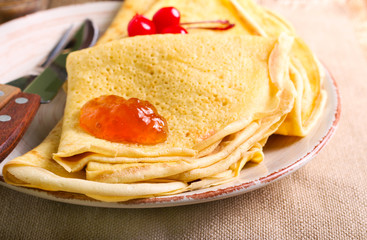 Crepes with marmalade on plate,