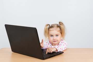  little girl at the computer.