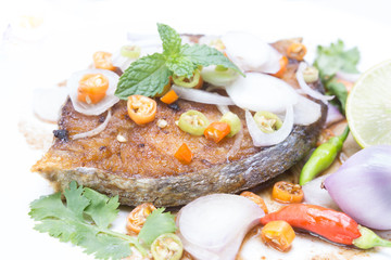 Fototapeta na wymiar Fried King mackerel Fish with fish sauce