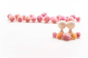 Couple dolls and lots of flowers. Disturbed spitting blessing to such a warm flowers a lot.