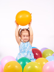 Fototapeta na wymiar Little girl playing with balloons.