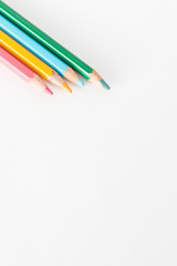 Closeup of Colour pencils on white background, selective focus