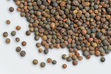 Raw lentils on white background