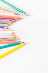 Closeup of Colour pencils on white background, selective focus