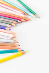 Closeup of Colour pencils on white background, selective focus