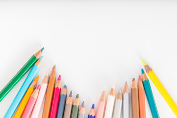 Closeup of Colour pencils on white background, selective focus