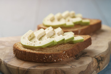 open sandwiches with avocado and spices, shallow focus