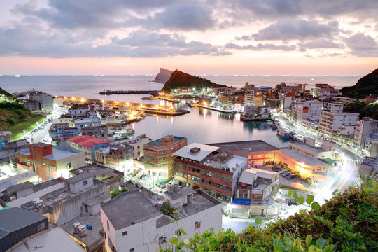 Scenery of misty early morning at Yehliu, a fishing village at dawn on northern coast of Taipei Taiwan ~ View of coast highway, harbor, coastline, Geological landscape park under dramatic dawning sky