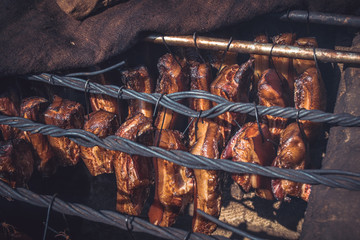 Smoked sausuages and meet in smokehouse