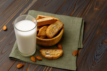 Italian cantuccini cookie with almond filling on wooden background
