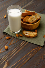 Italian cantuccini cookie with almond filling on wooden background