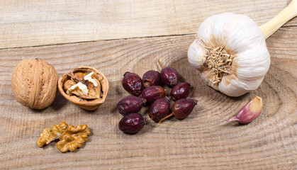 Dried fruit of hawthorn, garlic and walnuts. The concept of alternative medicine.