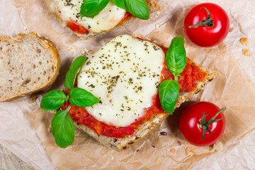 Italian bruschetta with cherry tomatoes, mozzarella & fresh basil.