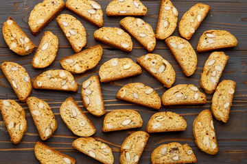 Italian cantuccini cookie with almond filling on wooden background