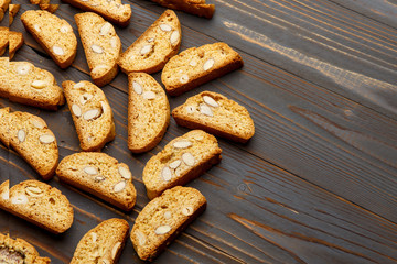 Italian cantuccini cookie with almond filling on wooden background
