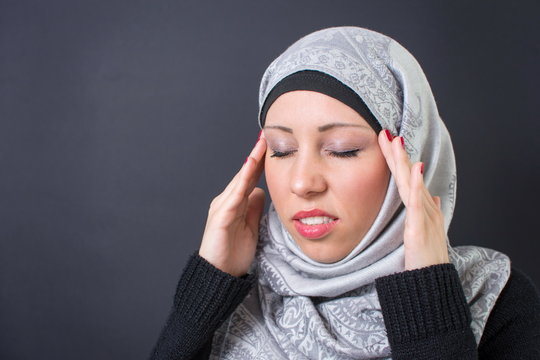Muslim woman with a headache