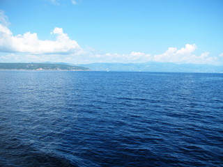 blue sea on background of island