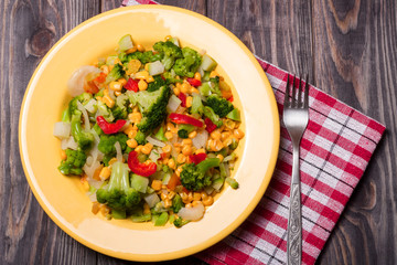 raw vegetable mix on the yellow plate