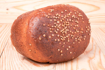Black bread with fresh coriander closeup