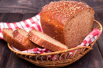 Black bread with fresh coriander closeup