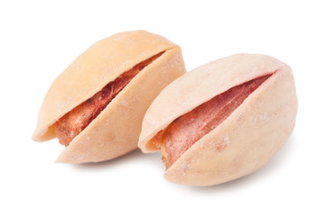 Two pistachios isolated on white background close-up macro