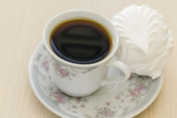 Cup with coffee and cake.
