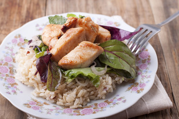  Fried chicken with rice and salad.
