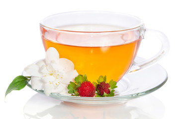 Cup of tea with jasmine and strawbarries on white