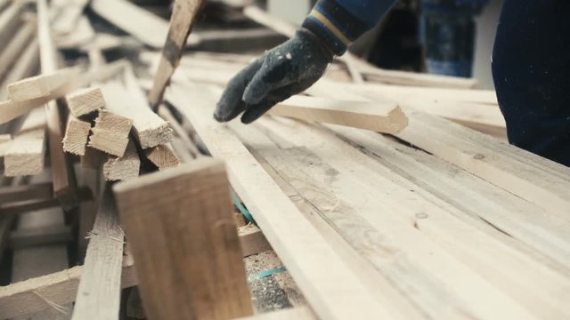 Man working with wood at sawmill