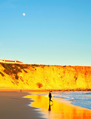 Surfer and full moon, Portugal