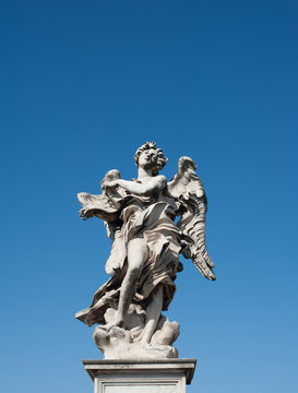 Angel old roman statue on blue sky