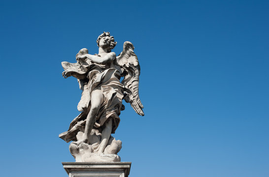 Angel old roman statue on blue sky