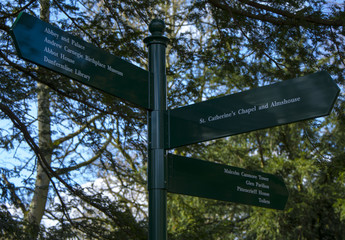 Signpost situated in the Dunfermline park, in front of the abbey, directing people towards various destinations.