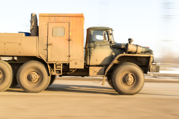 Blurred Moving Russian Industrial Vehicle