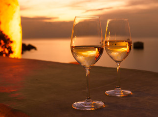 Pair of wine lasses against a beautiful sunset. 