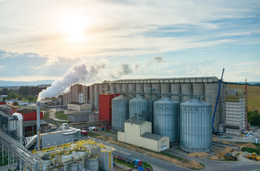 Sunset over biofuel factory © Stockr